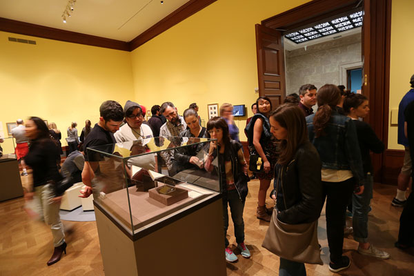 Visitors in a museum gallery.